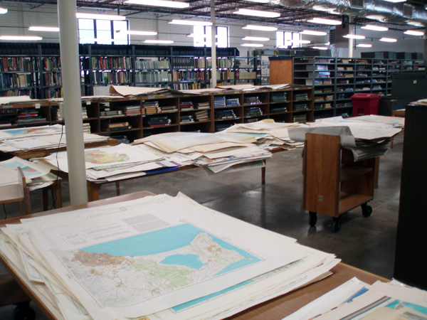 Figure 4. Uncataloged maps being sorted in our old space. Tables were set up
where the map cases used to be.