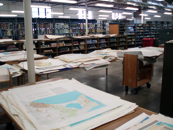 Figure 4. Uncataloged maps being sorted in our old space. Tables were set up
where the map cases used to be.