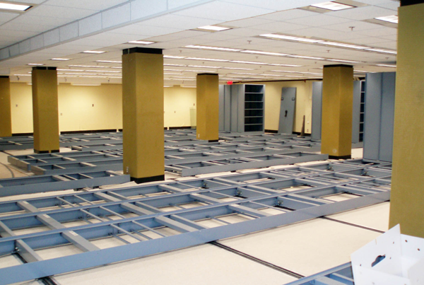 Figure 5. Compact shelving carriages ready for map cases. Note the “retro”
mustard yellow pillars that were last painted in the 1970s—fortunately, they have
since been painted an off-white.