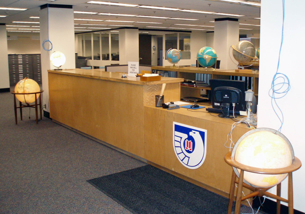 Figure 8. Reference desk with the GIS lab in the background. Note the hanging
wires—still a work in progress.