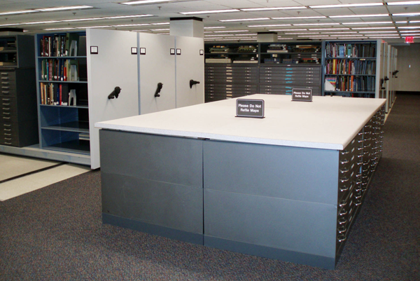 Figure 10. Map cases in the Map and Government Information Library. The table
top on the low cases was built for MAGIL. Note the atlas shelves on top of the map
cases in the background.