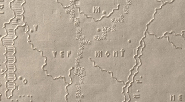 This enlarged view of the Vermont map shows the various symbols used as well as the impressions of the underlying blocks used in the embossing method. Mountains are shown as a series of short lines in this detail of the Green Mountains.