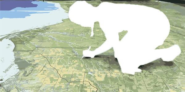 A person kneeling on top of a large map covering the floor. The person is silhouetted in white.