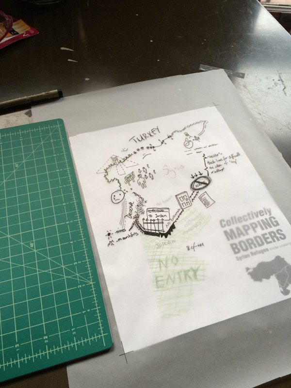 Figure 5. A photo mid-process that shows my ink tracing on top of the composite representation of Syria.