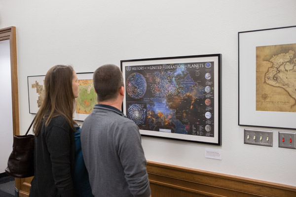 Figure 4. Exhibit attendees viewing the United Federation of Planets map.