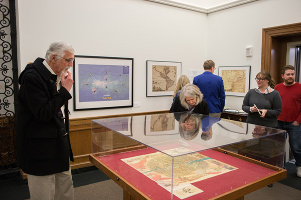 Figure 6. Exhibit attendees viewing the map of Ankh-Morpork.