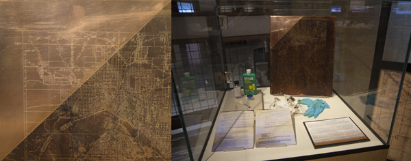 Figure 2. Left: detail of a copper plate showing before and after cleaning. Right: display case highlighting the cleaning process.